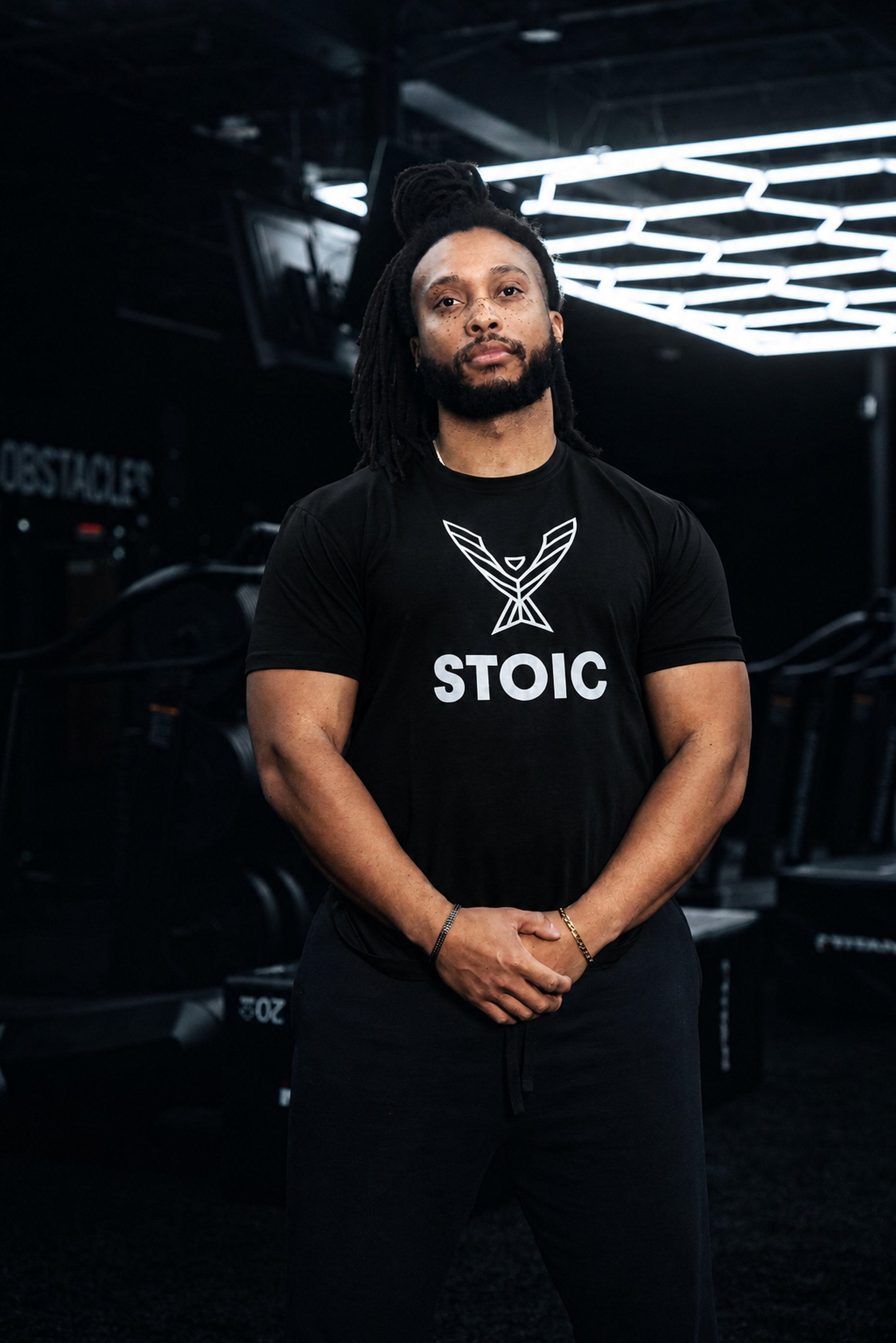 Man wearing the Stoic Performance black logo t-shirt in the gym