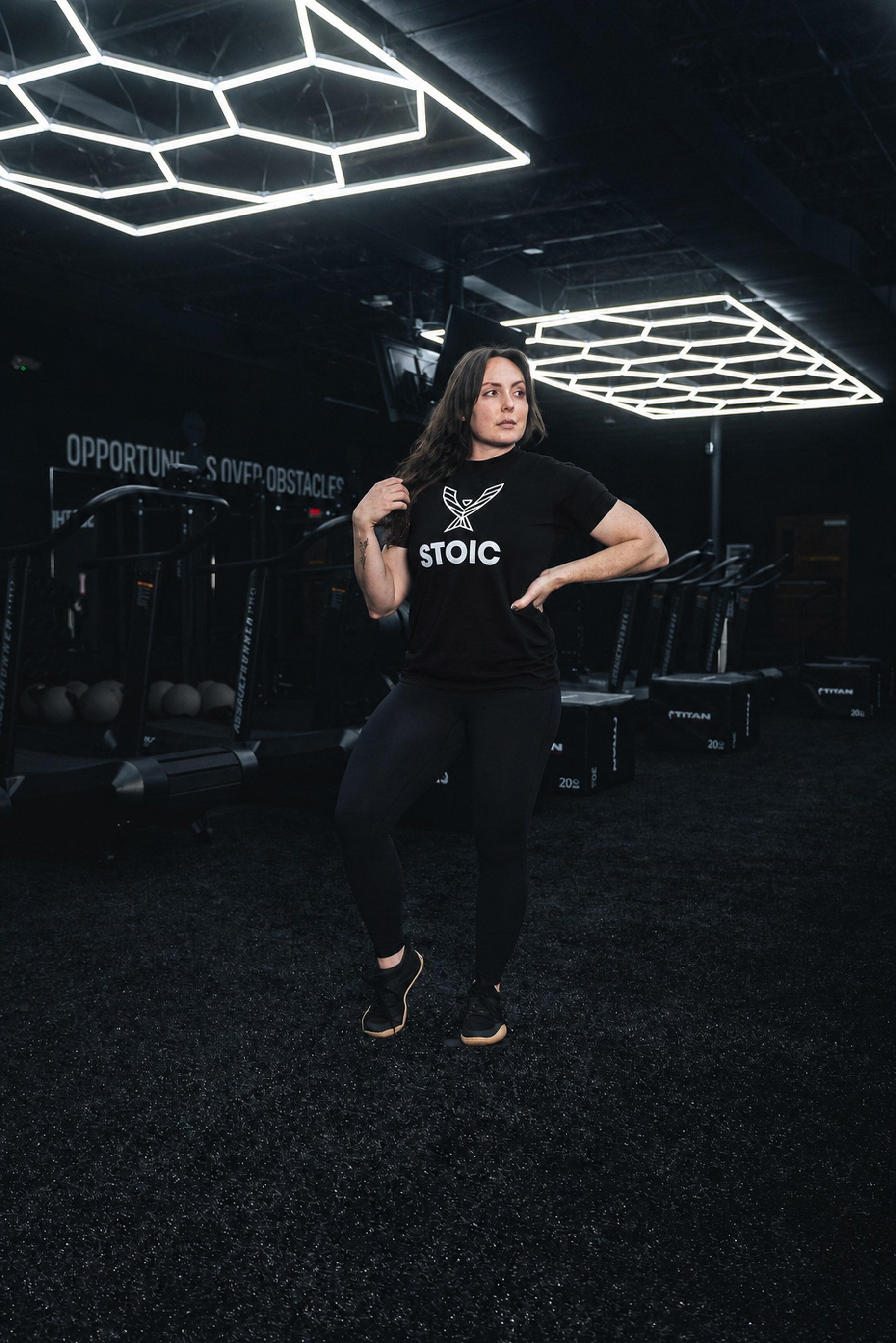 Full-length view of the women's Stoic Performance black logo t-shirt