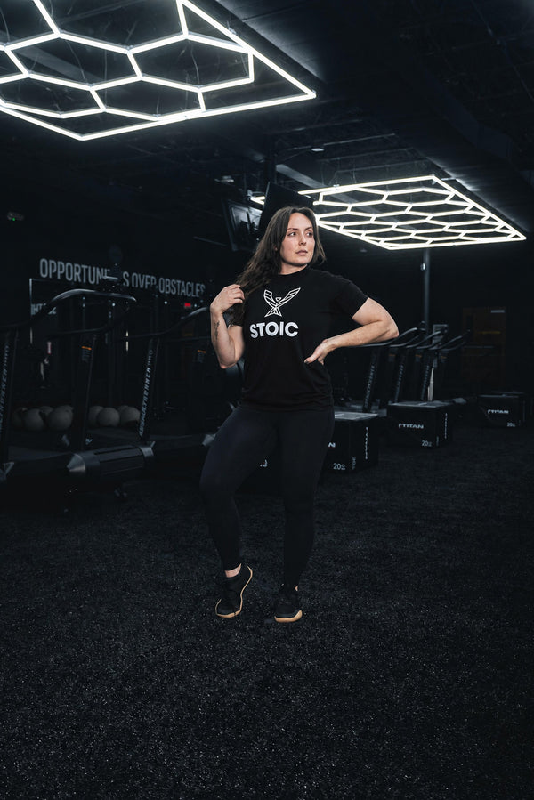 Full-length view of the women's Stoic Performance black logo t-shirt