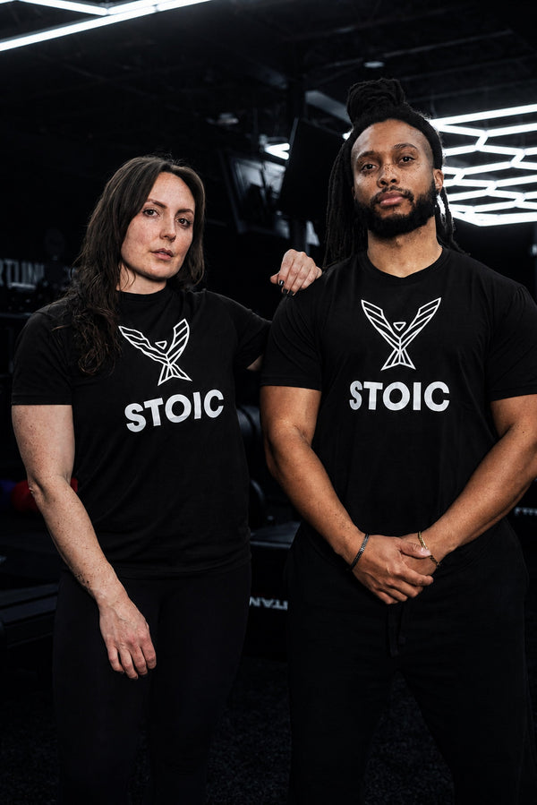 Men's and women's Stoic Performance black logo t-shirts shown together