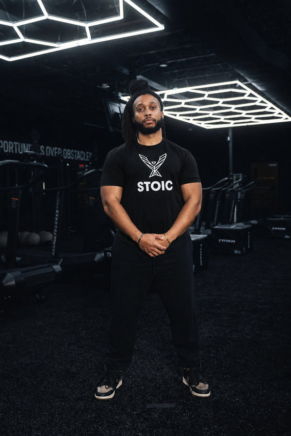 Full-length view of the men's Stoic Performance black logo t-shirt