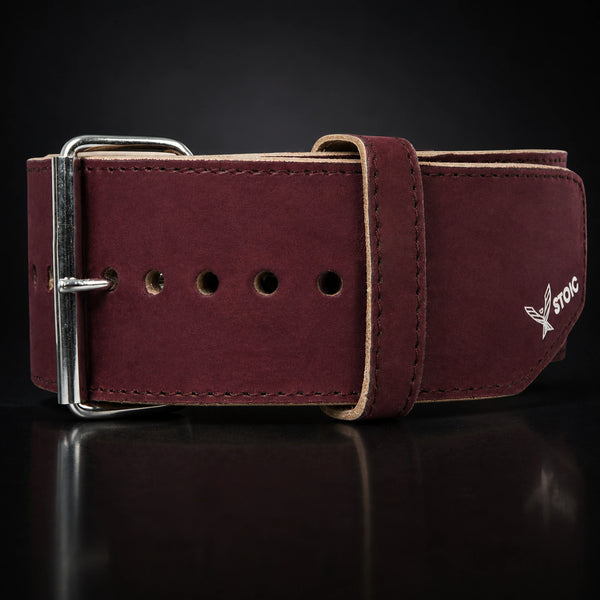 Stoic 10mm single-prong weight lifting belt in maroon, a close view of the single-prong roller buckle, keeper loop and adjustment holes.