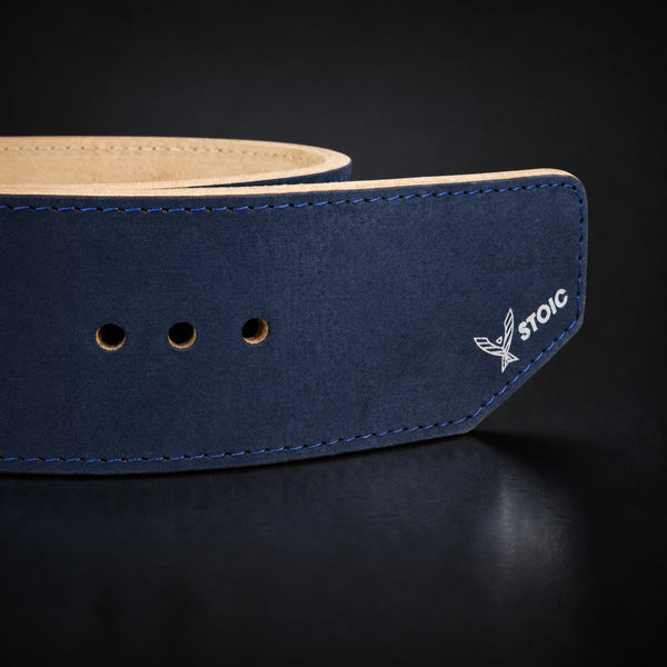 Stoic 10mm single-prong weight lifting belt in navy, a close view of the strap, its adjustment holes and the angled tail tip.
