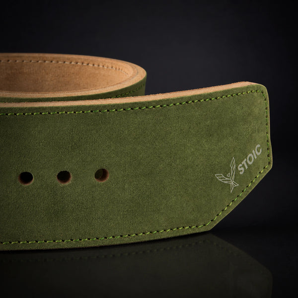 Stoic 10mm single-prong weight lifting belt in olive drab, a close view of the strap, its adjustment holes and the angled tail tip.