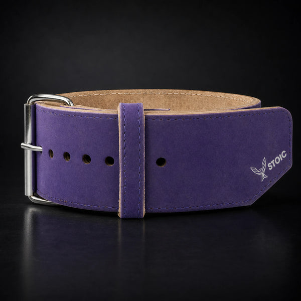 Stoic 10mm single-prong weight lifting belt in purple, the belt photographed square-on, showing the single-prong roller buckle and the keeper loop.