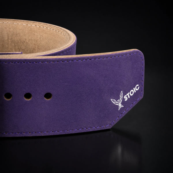 Stoic 10mm single-prong weight lifting belt in purple, a close view of the strap, its adjustment holes and the angled tail tip.