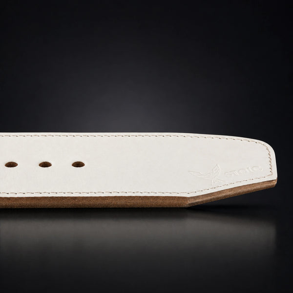 Stoic 10mm single-prong weight lifting belt in white, a close view of the tail, its adjustment holes and the angled chamfered tip.
