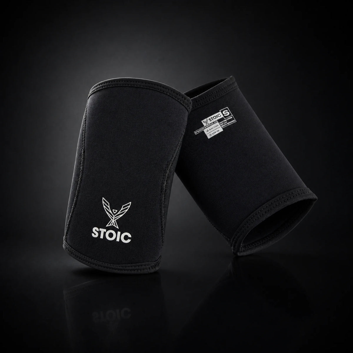 Stoic 7mm elbow sleeves for weightlifting, on a dark studio background