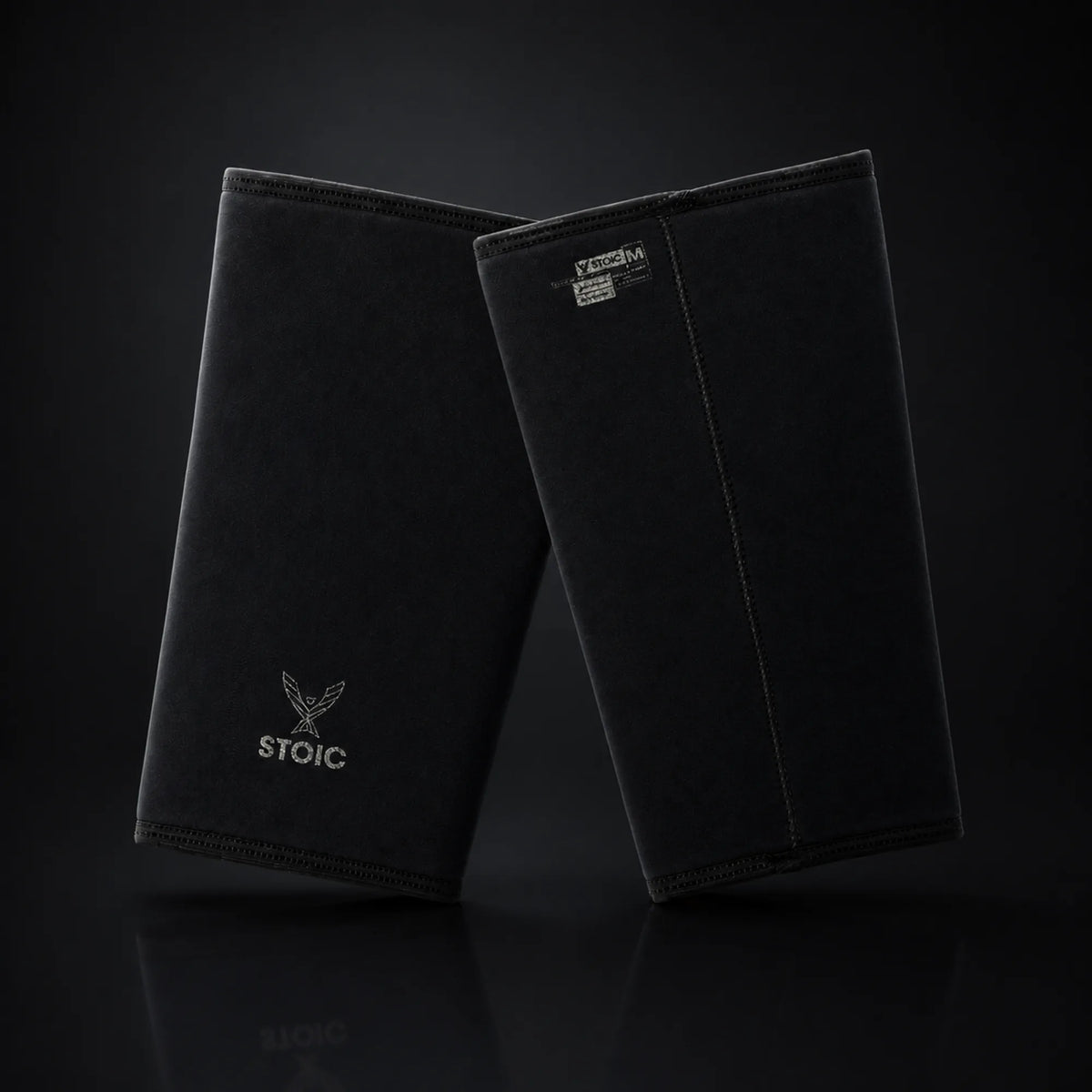 Stoic 7mm knee sleeves for weightlifting in Black Label, on a dark studio background