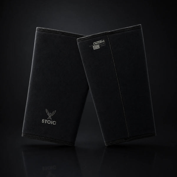 Stoic 7mm knee sleeves for weightlifting in Black Label, on a dark studio background