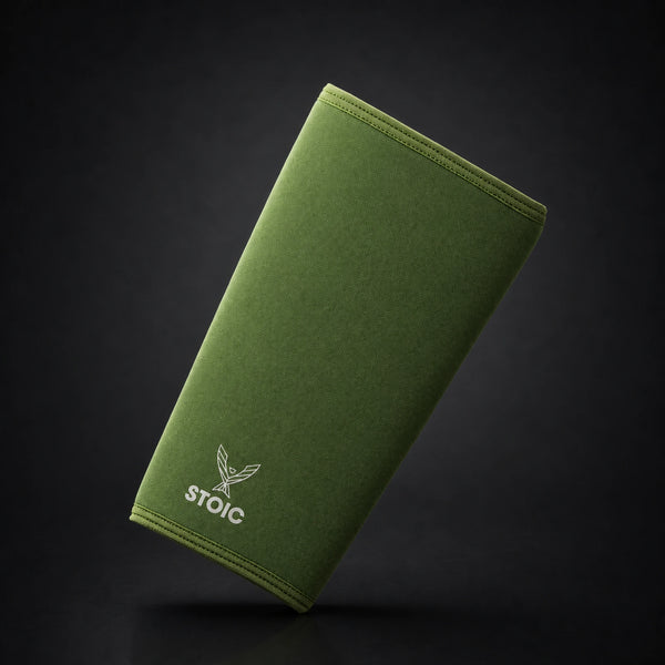 Stoic 7mm knee sleeves for weightlifting in olive drab, a single sleeve leaning at an angle, front face with the phoenix logo.