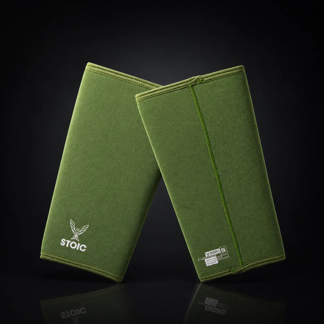 Stoic 7mm knee sleeves for weightlifting in olive drab, on a dark studio background
