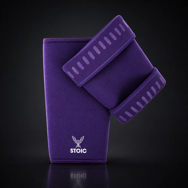 Stoic 7mm knee sleeves for weightlifting in purple, the pair arranged with one sleeve showing the phoenix logo on its front and the other turned to reveal the silicone grip dashes inside the cuffs.