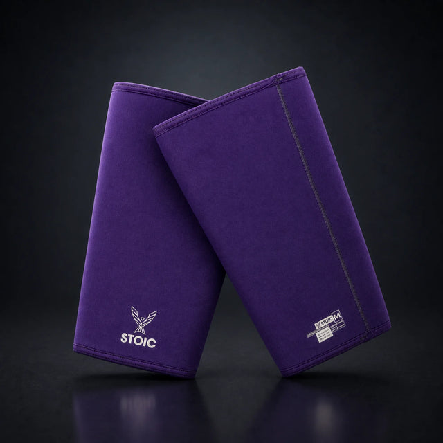 Stoic 7mm knee sleeves for weightlifting in purple, on a dark studio background