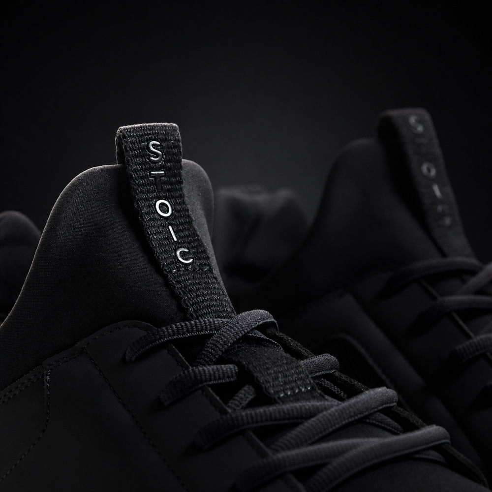 Stoic Barefoot Trainer zero-drop lifting shoe, flat sole detail, on a dark studio background