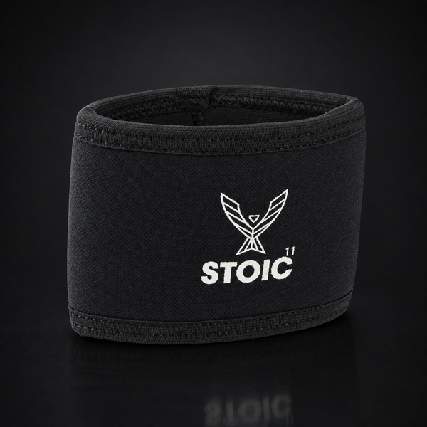 Stoic compression sleeve cuff in black, on a dark studio background