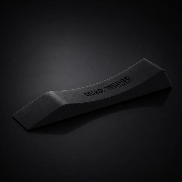 Stoic dead wedge deadlift jack in black, on a dark studio background