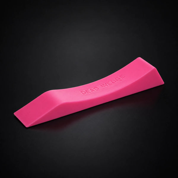 Stoic dead wedge deadlift jack in pink, on a dark studio background