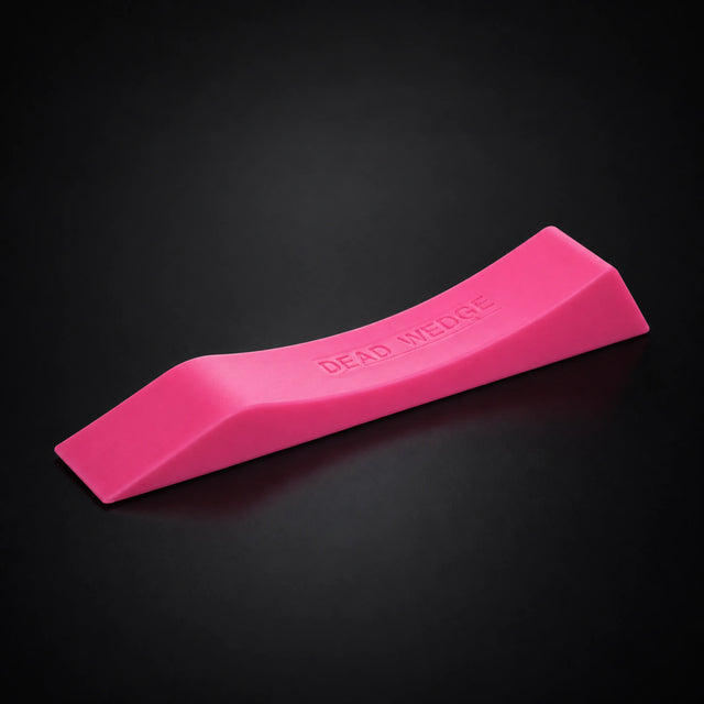 Stoic dead wedge deadlift jack in pink, on a dark studio background