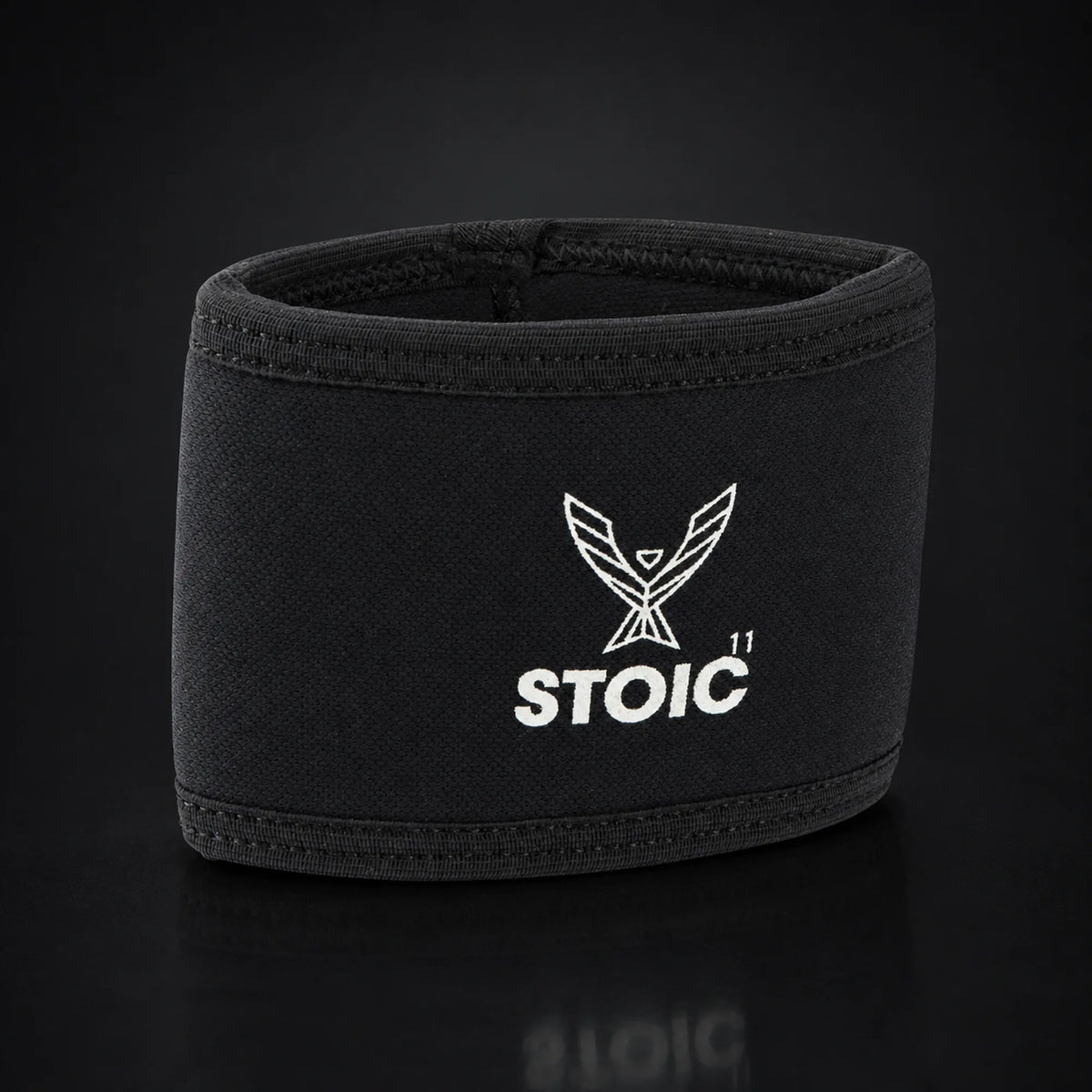 Stoic elbow compression cuff, on a dark studio background