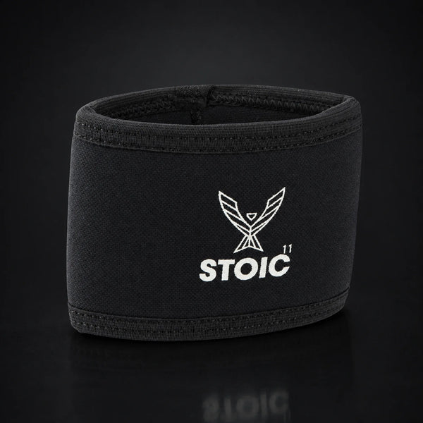 Stoic elbow compression cuff, on a dark studio background