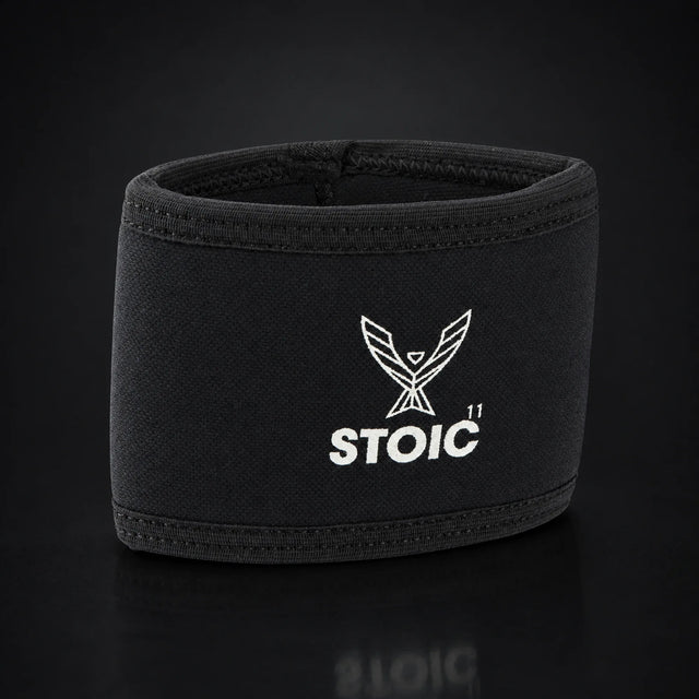 Stoic elbow compression cuff, on a dark studio background