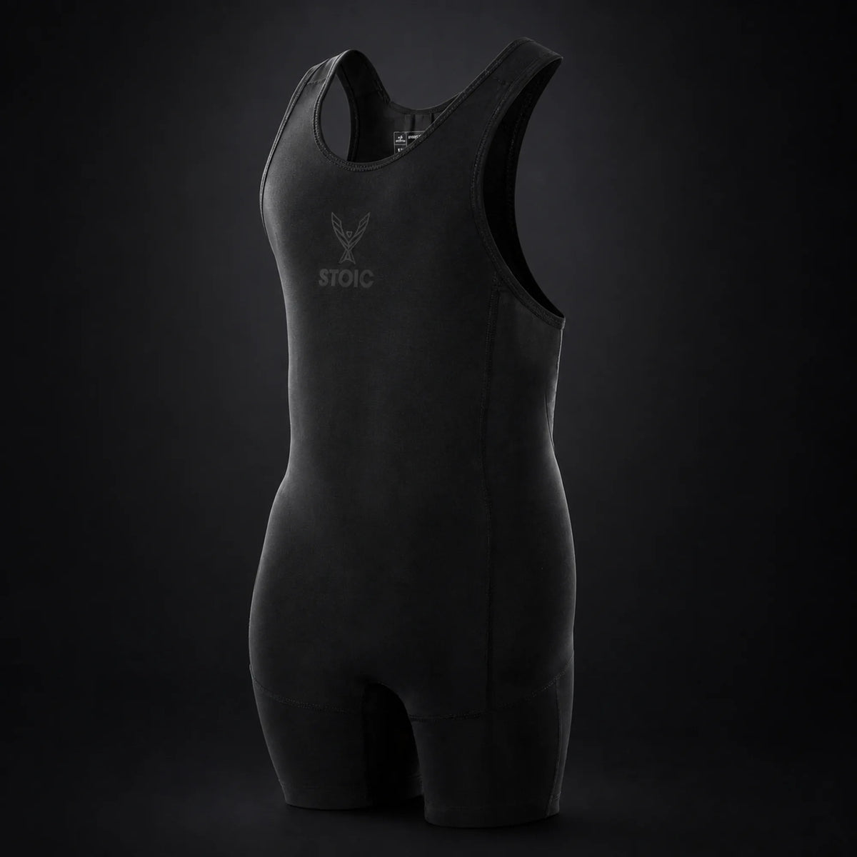 Stoic lifting singlet in Black Label, on a dark studio background