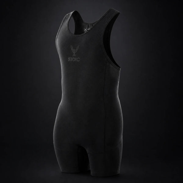Stoic lifting singlet in Black Label, on a dark studio background