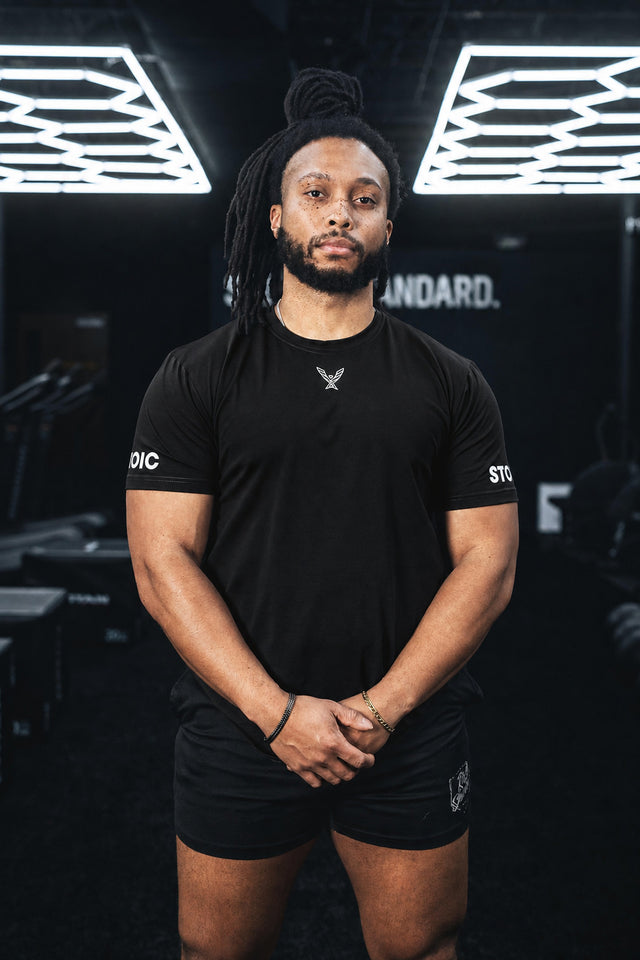 Stoic Competition T-Shirt in black, front view on lifter in gym
