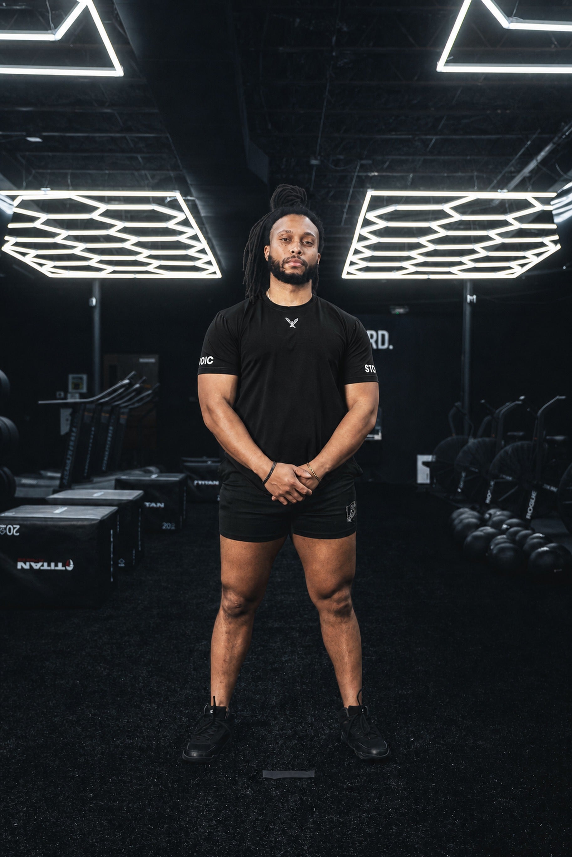 Full body view of the black Stoic Competition T-Shirt in the gym