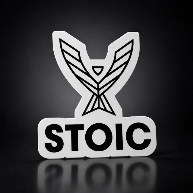 Stoic die-cut vinyl sticker, 2.75 inch, white vinyl with the black phoenix and STOIC logo, on a dark studio background