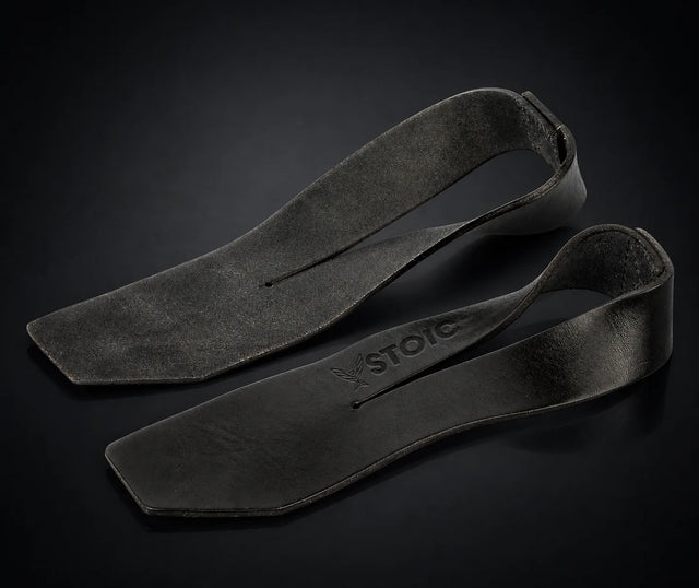 Stoic weight lifting straps, on a dark studio background