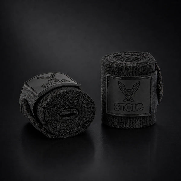 Stoic wrist wraps for weightlifting in Black Label, on a dark studio background