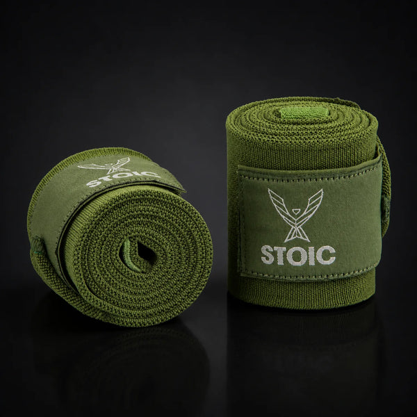 Stoic wrist wraps for weightlifting in olive drab, on a dark studio background